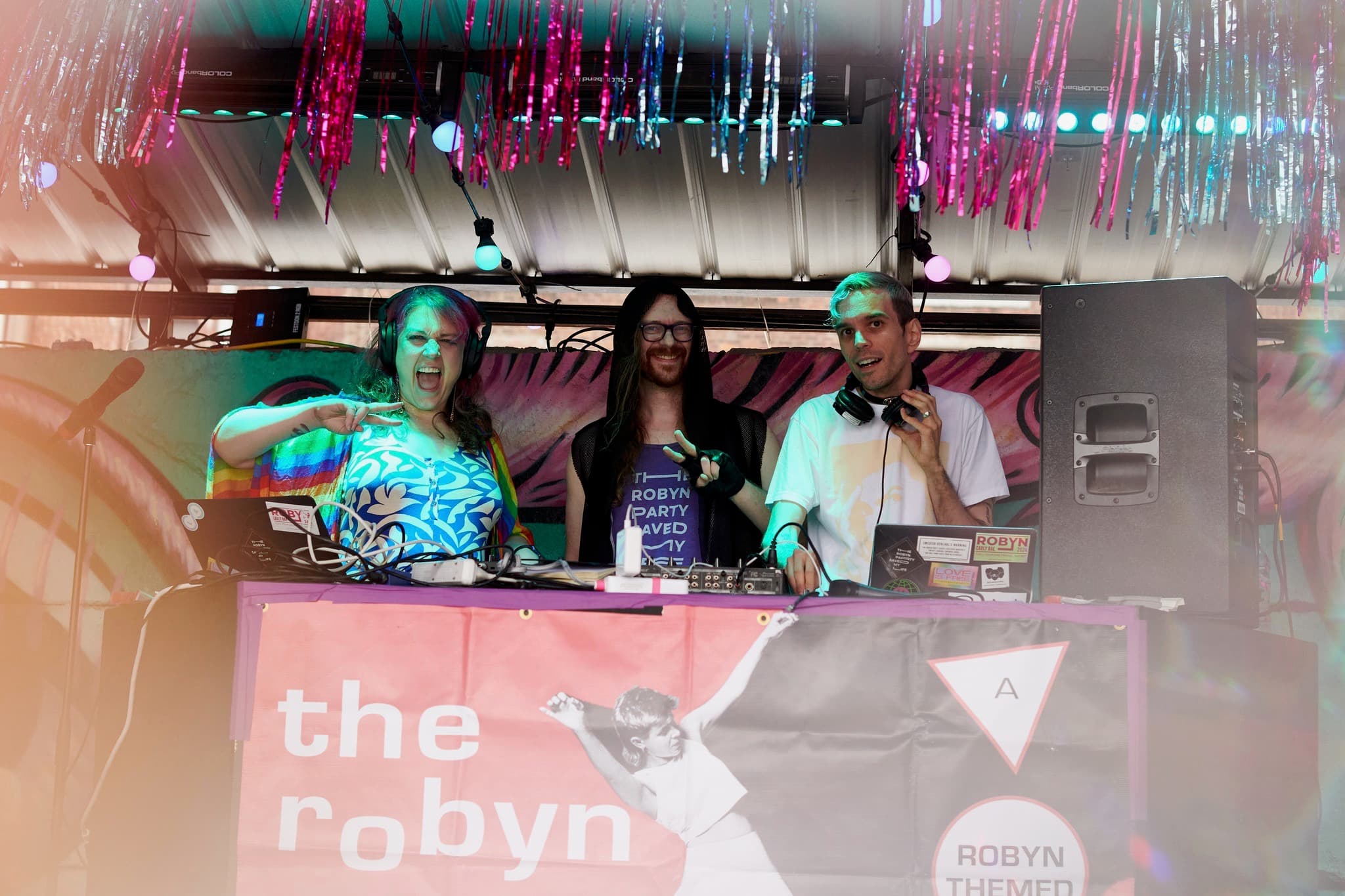 Three DJs behind the booth at The Robyn Party